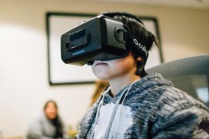 Young boy in VR goggles