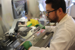 Carlos Marti-Figueroa, a PhD student in the lab of Biomedical Engineering Assistant Professor Randolph Ashton, works on injecting stem cells into alginate hydrogels. Photo: Renee Meiller.