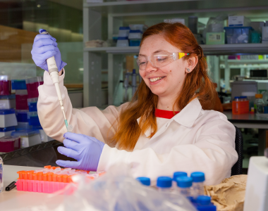 Hayley Boigenzahn uses a pipette in the lab