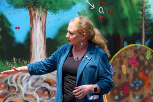 WID director Jo Handelsman describing a feature of the carbon cycle mural