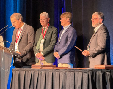 Steve Wright (second from left) receives the Dantzig Award at the 25th International Symposium on Mathematical Programming in Montreal on July 22, 2024. Photo by Bill Cook.