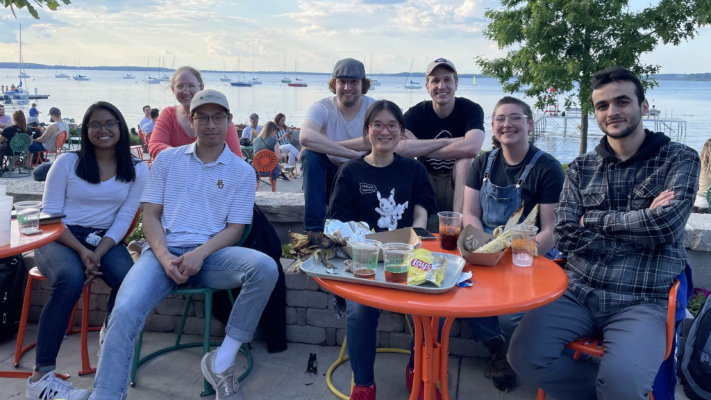 Sridharan Lab group on the Memorial Union Terrace with Lake Mendota in the background