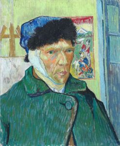 Self portrait of man wearing a green jacket with a blue hat with fur trim and an ear bandage