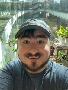 Austin Hall with a background of plants and the Discovery Building atrium.