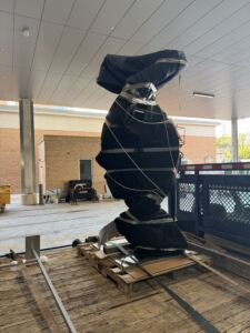 Large black plastic wrapped sculpture