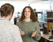 Anna Tommasi speaks to a colleague in the lab.
